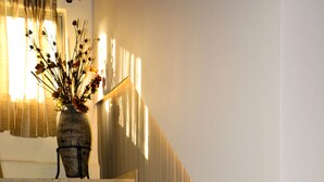 A staircase with a vase of flowers at the top. - Hotel Marily (Pyrgos)