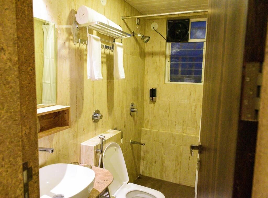 Shower, free toiletries, hair dryer, slippers