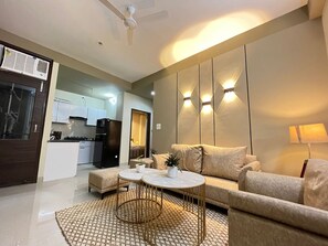 Apartment, 2 Bedrooms | Living room | 35-inch flat-screen TV with satellite channels, TV - BedChambers Serviced Apartments Gurgaon (Gurugram)