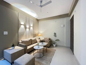 Apartment, 2 Bedrooms | Living room | 35-inch flat-screen TV with satellite channels, TV - BedChambers Serviced Apartments Gurgaon (Gurugram)