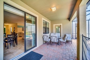 Enjoy a comfortable outdoor seating area with a clear view of the adjacent living room from this spacious balcony.