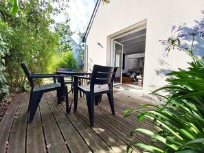 Relax on the patio surrounded by lush greenery and enjoy the view from the comfort of your own space.