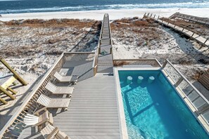 A heated pool - Resting Beach Place by GSVR | Beachfront Home w/ Pool, Game Room/Theater + FREE Activities/Golf (Gulf Shores)