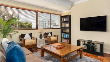 Classic Apartment | Living area | 52-inch flat-screen TV with cable channels, TV, Netflix