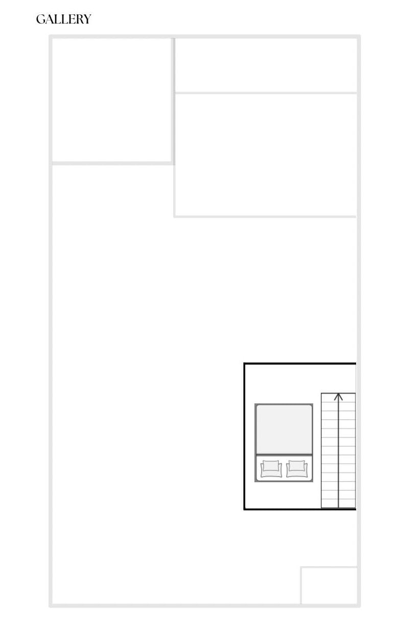A hotel room layout with a large bed, a small table, and a wardrobe.