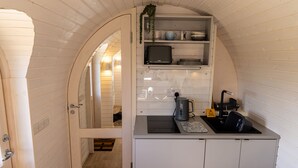 A compact kitchen with white cabinetry, a sink, a coffee maker, and a toaster. - Indrek - Mayflower Meadow (Driffield)