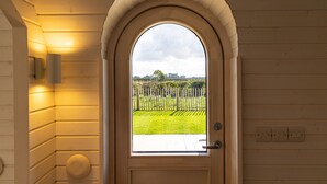 A wooden door with a semi-circular arch and a window. - Indrek - Mayflower Meadow (Driffield)