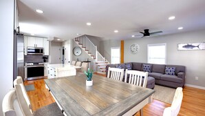A modern kitchen with white cabinets, a built-in oven, and a microwave. - Private Heated Pool - 1 Block from the Beach! (Tybee Island)