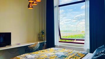 1 bedroom, desk, iron/ironing board, travel crib