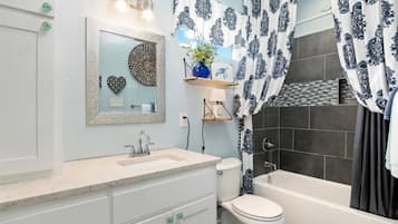 Combined shower/tub, hair dryer, towels, soap
