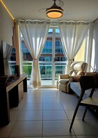 Premium Duplex | Living area | 56-inch LED TV with cable channels, TV