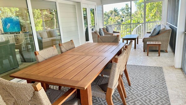 Outdoor dining - Sea Babe: Coastal Luxury Meets Family Fun: Pool, Elevator, Near Beach, Pet Friendly (Sanibel)