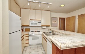 Fridge, microwave, oven, dining tables