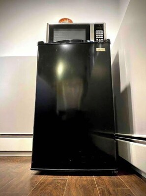 Fridge, microwave, coffee/tea maker, cookware/dishes/utensils