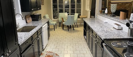 Coffee/tea maker, fridge, microwave, oven