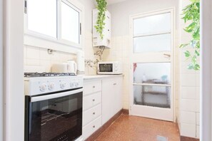 Microwave, coffee/tea maker, toaster, cookware/dishes/utensils