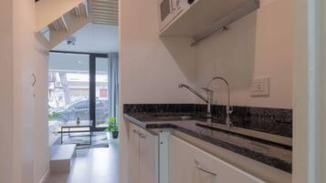 Microwave, coffee/tea maker, toaster, cookware/dishes/utensils