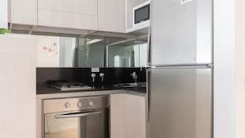 Microwave, coffee/tea maker, toaster, cookware/dishes/utensils