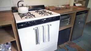 Enjoy cooking in this fully equipped kitchen with a gas stove, oven, and dishwasher.