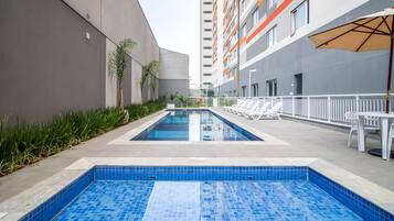 Outdoor pool, pool umbrellas, sun loungers