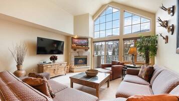 Deluxe Condo, 3 Bedrooms | Living area | 40-inch flat-screen TV with cable channels, TV, fireplace