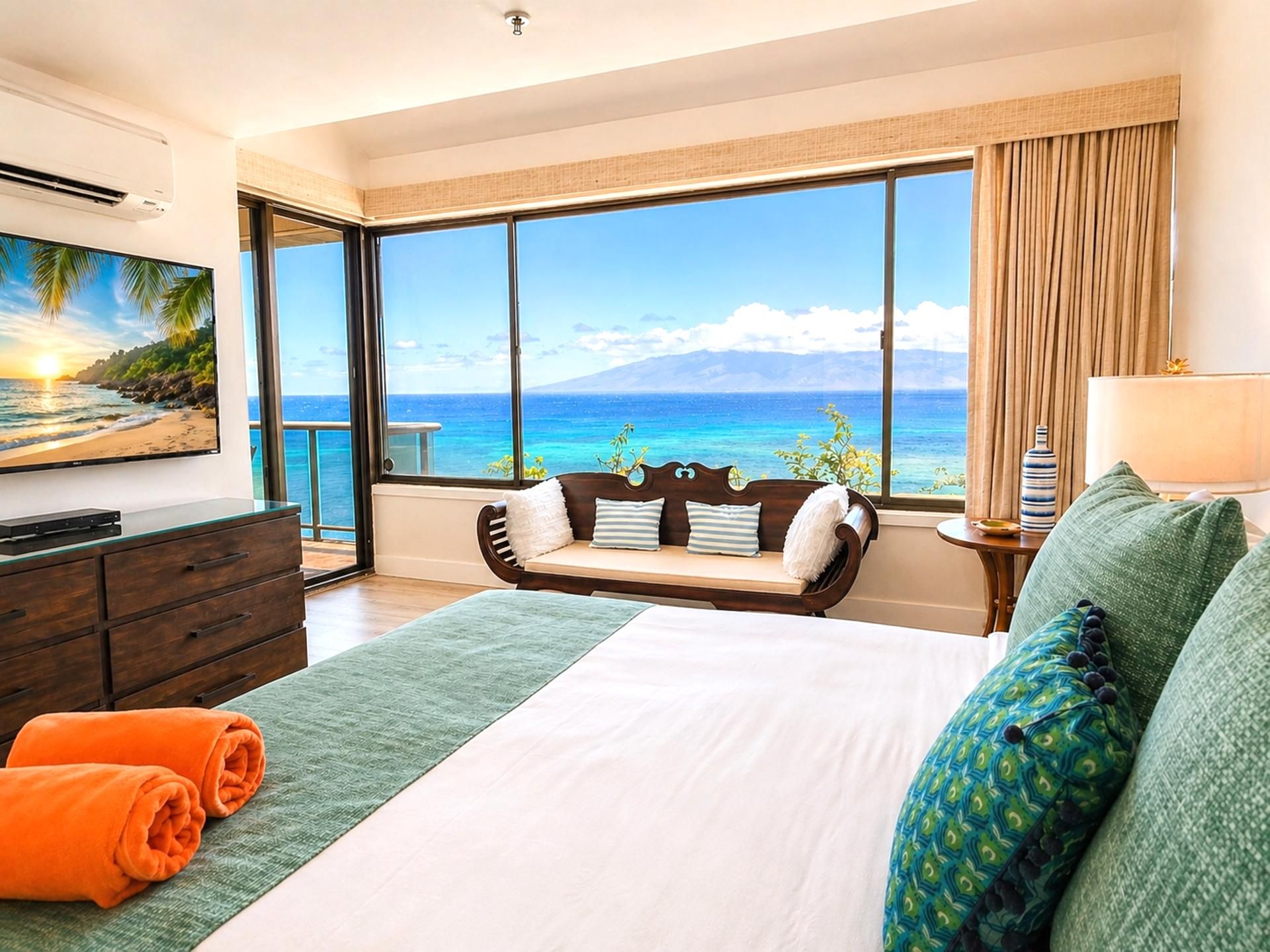 A hotel room with a large window, a bed, a sofa, a TV, and a dresser.