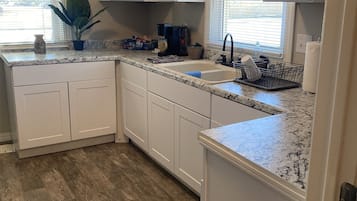 Fridge, microwave, stovetop, coffee/tea maker