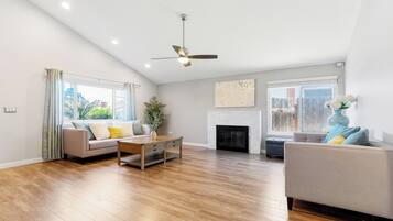 Smart TV, fireplace, books, offices