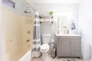Combined shower/tub, hair dryer, towels, soap