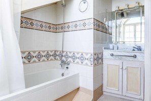 Bathtub, hair dryer, towels