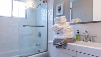 Bathtub, hair dryer, towels