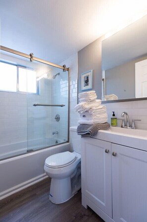 Bathtub, hair dryer, towels