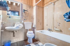 Bathtub, hair dryer, towels