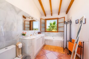 Bathtub, hair dryer, towels