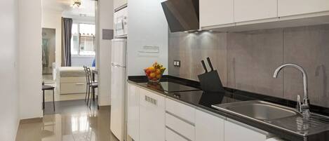 Fridge, microwave, stovetop, coffee/tea maker