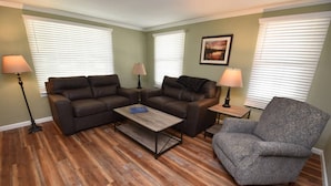 A living room with two sofas, a coffee table, and a patterned armchair. - 20 min Walk to ND, 3 bedroom 2 bath home(54475) (South Bend)