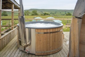 Outdoor spa tub - With views across Wether Fell, waking up in Goldfinch Yurt is like no other (Askrigg)