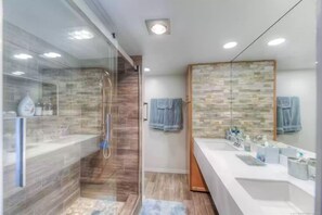 Combined shower/tub, hair dryer, towels, toilet paper