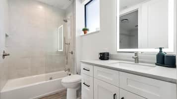 Combined shower/bathtub, hair dryer, towels, soap