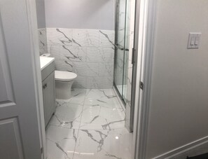Shower, towels, soap, toilet paper