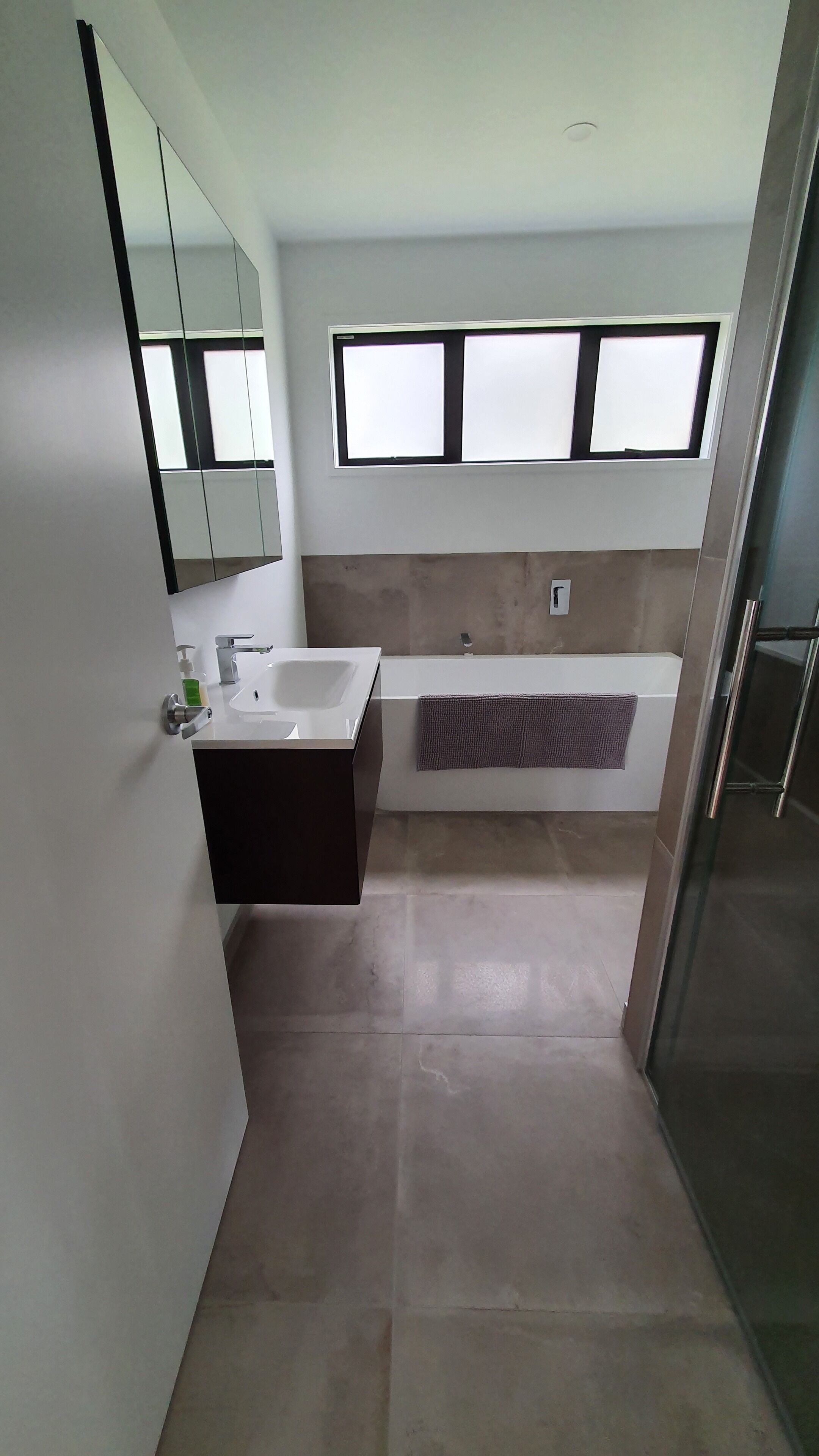 Bathtub, towels, soap, toilet paper