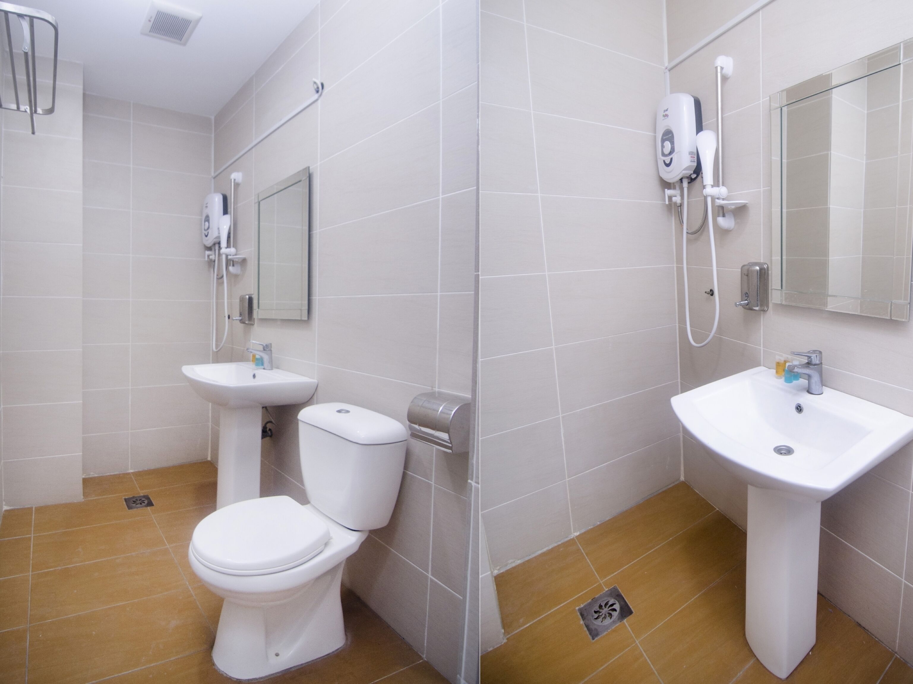 A modern bathroom with a toilet, sink, and shower.