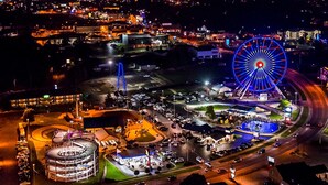 A large circular building with a central open area, surrounded by parking and roads. - FALLS - Shop Till You Drop, Then Relax in a Comfortable Studio Suite (Branson)