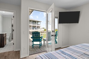 Enjoy a restful stay in this room with a large bed, flat-screen TV, and balcony with outdoor seating.