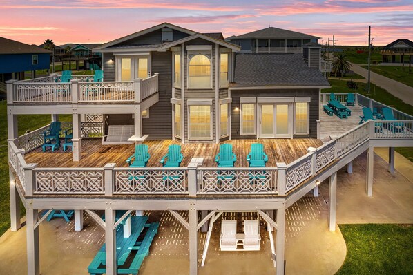 Enjoy outdoor dining and relaxation on the spacious deck with comfortable seating and a picnic table.