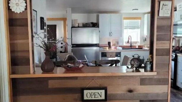 A kitchen with a wooden wall, a hanging light, and an 'OPEN' sign. - DE-stress in this quiet, serene cottage. Mountains, Horses, Verde River, Peace. (Payson)