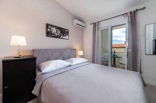 3 ensuite double A/C bedrooms.Balcony with partial seaview-3 min from the beach!
