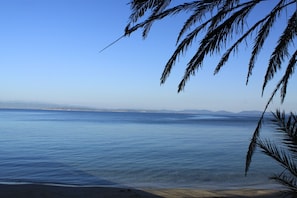 On the beach, sun-loungers