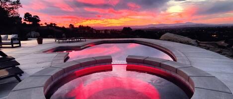 A heated pool, pool loungers