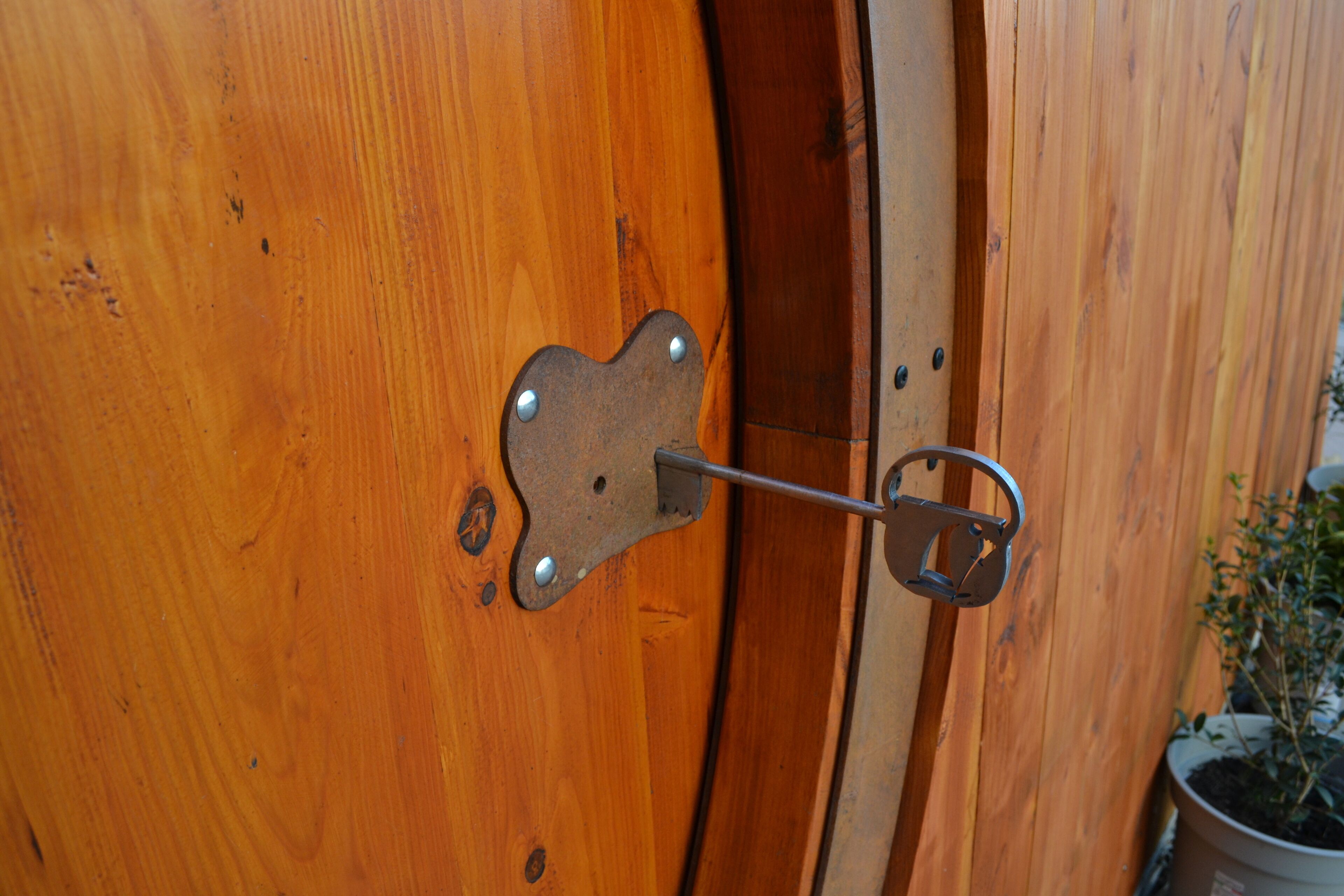 A wooden door with a metal latch.